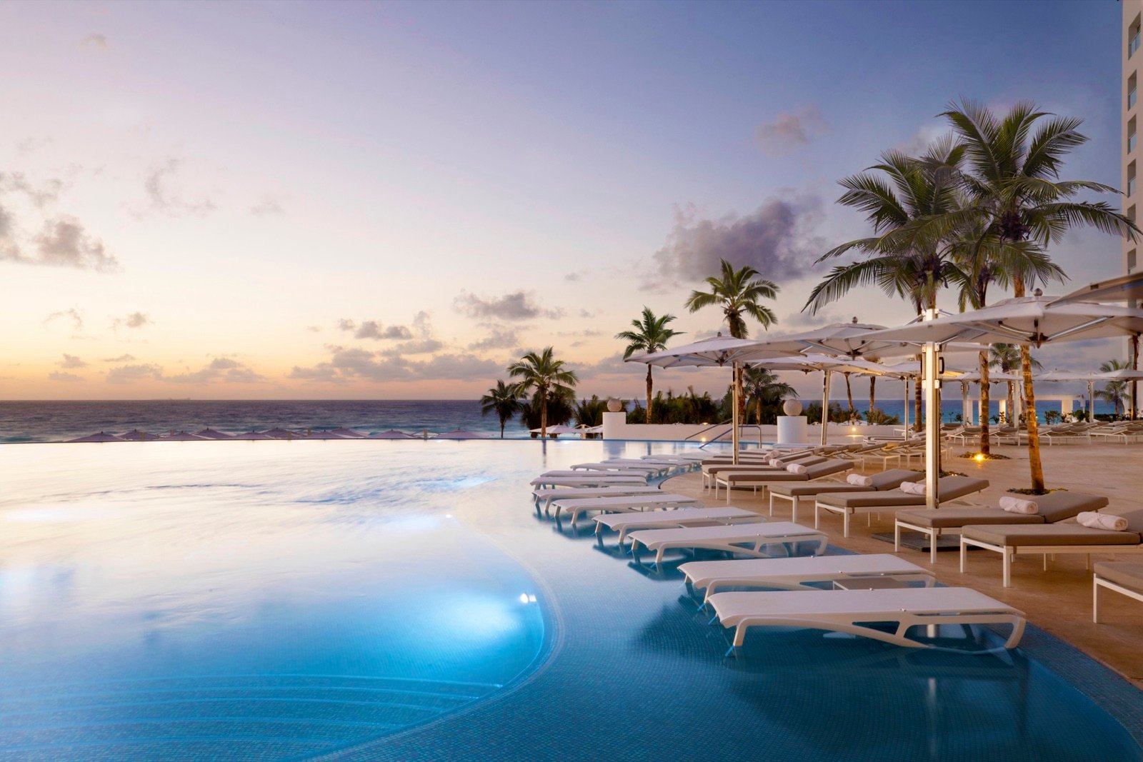 Le Blanc Spa Resort Cancun pool and beach at sunrise