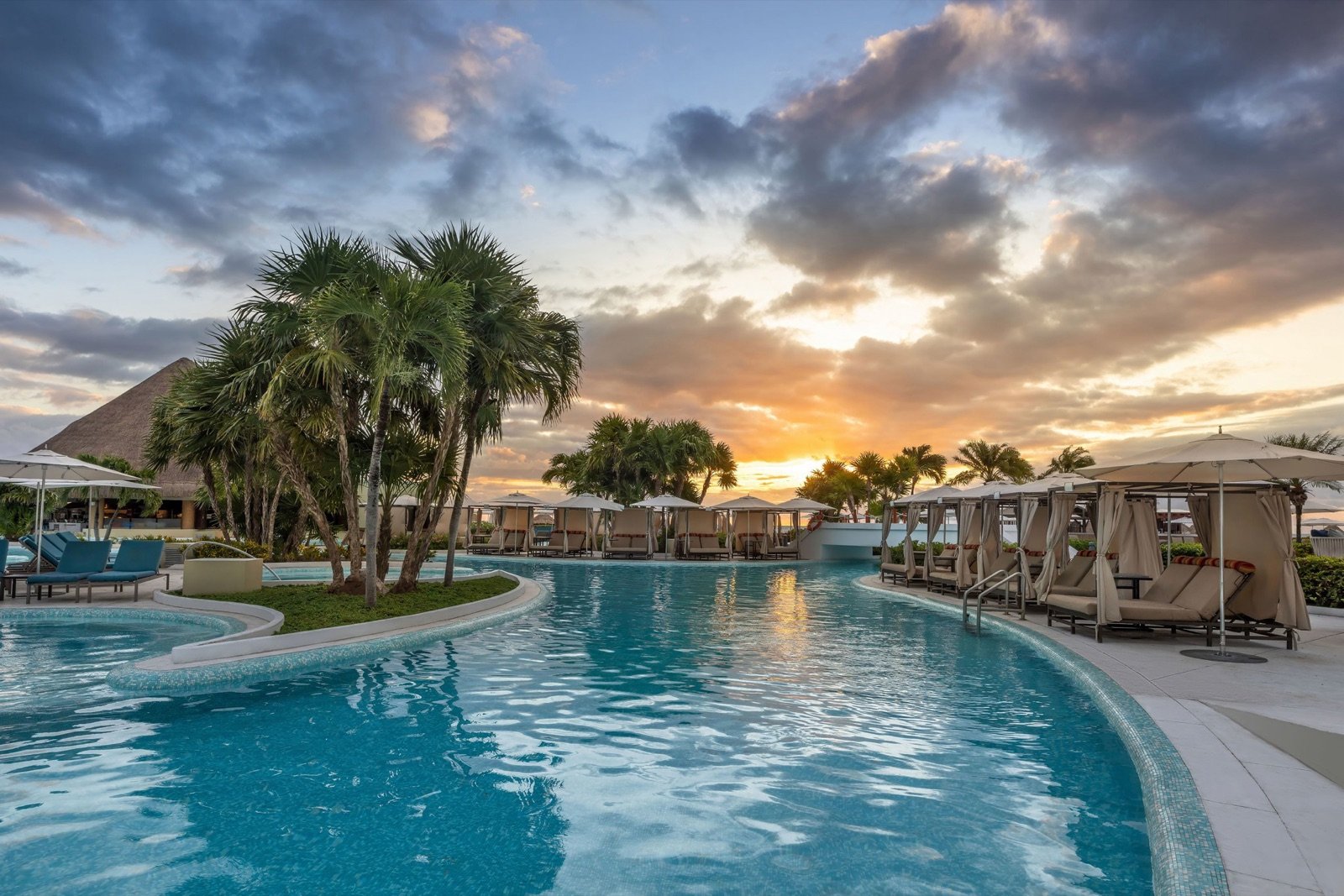 Moon Palace Cancun pool and cabanas at sunset